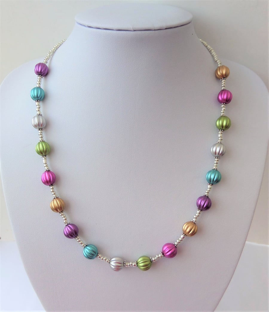 Multicoloured pumpkin bead and silver metallised seed bead necklace