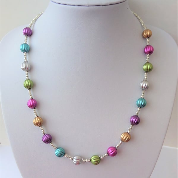 Multicoloured pumpkin bead and silver metallised seed bead necklace