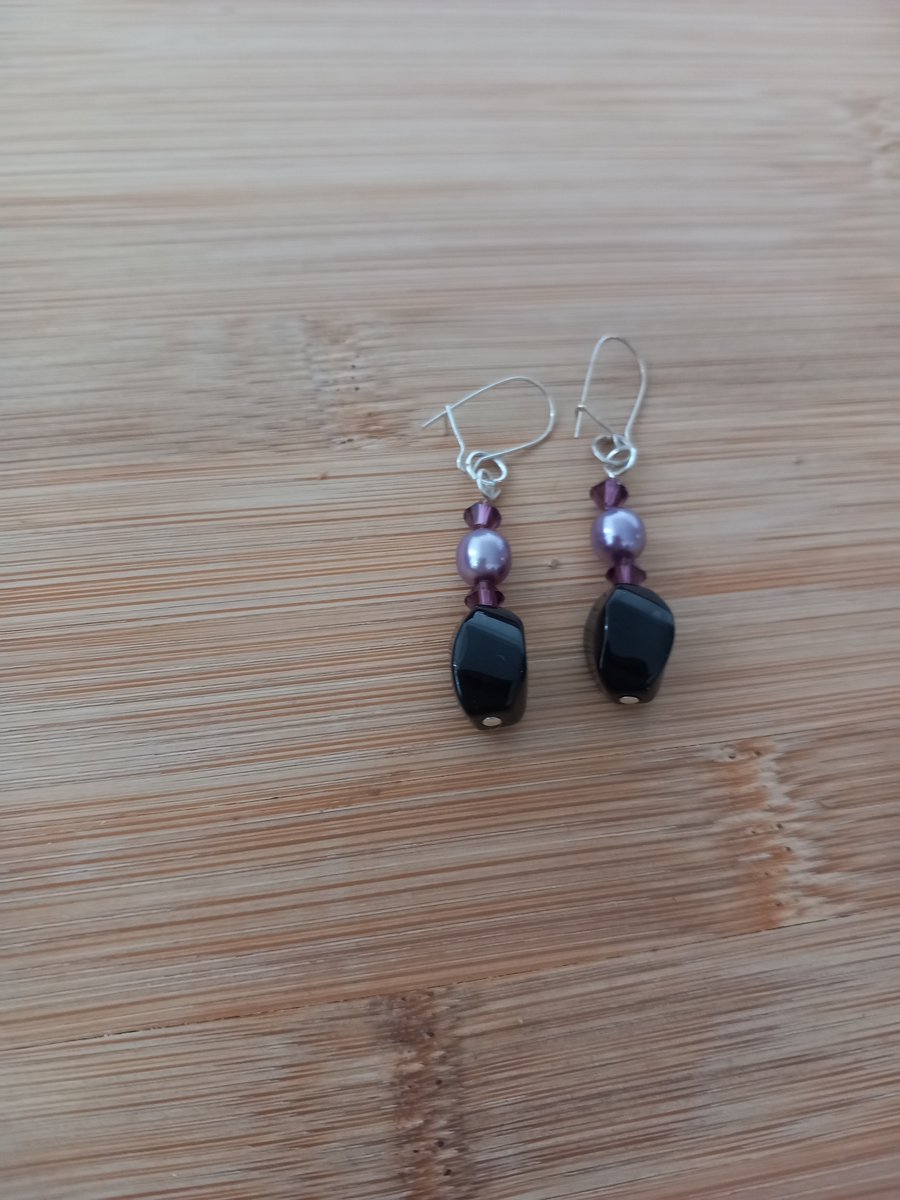 Black and purple beaded pearl drop earrings, pierced ears