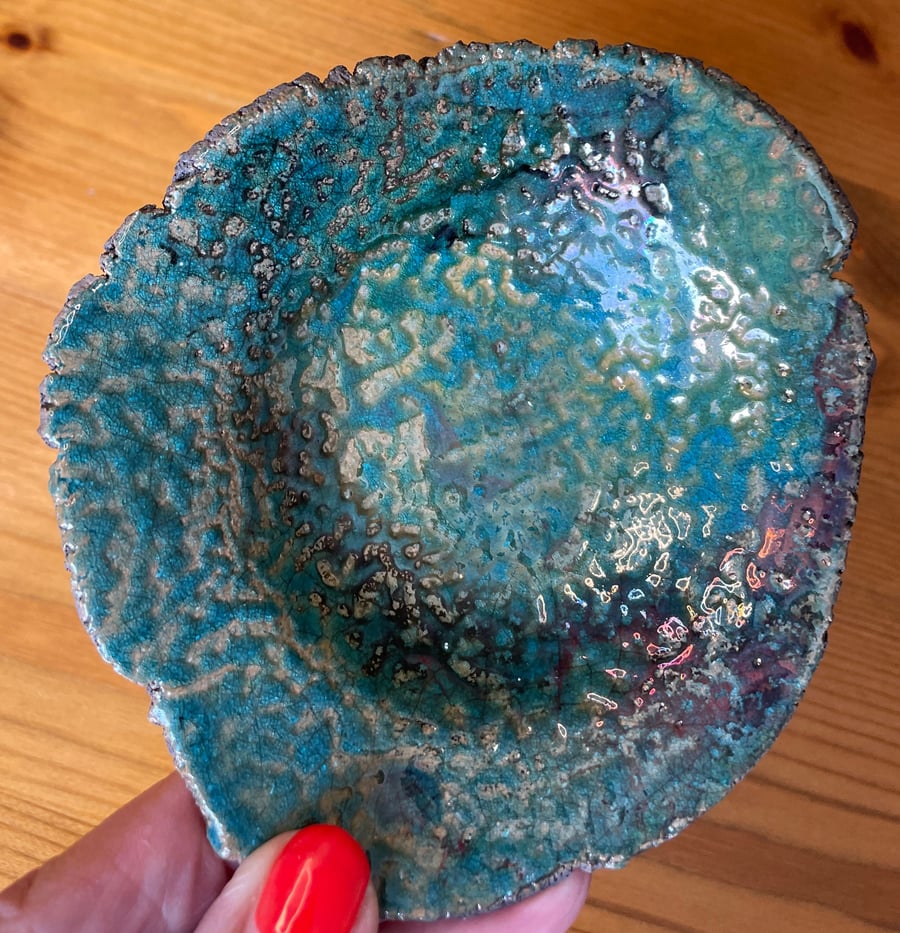 Raku ring dish with a unique aqua and copper rippled glaze effect