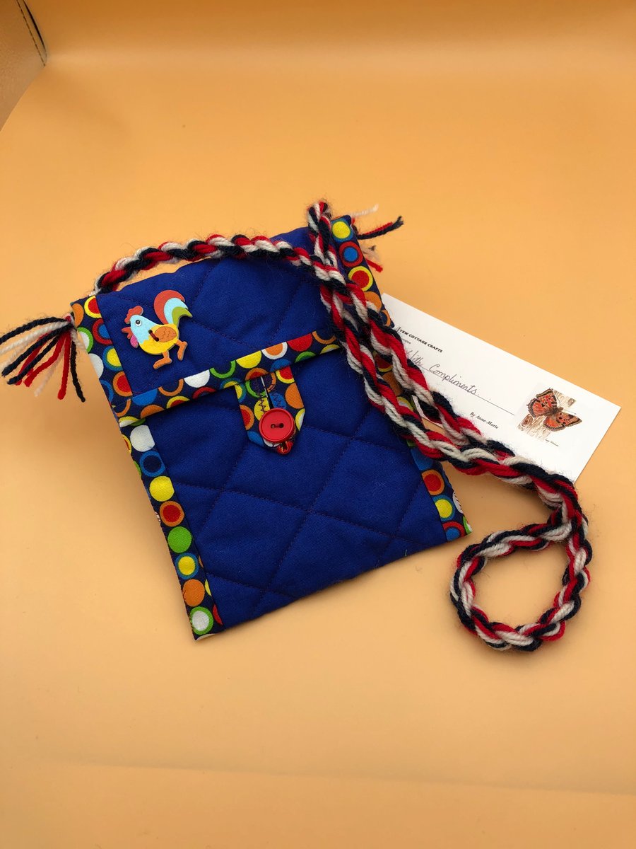 Child's quilted bag with chicken decoration.