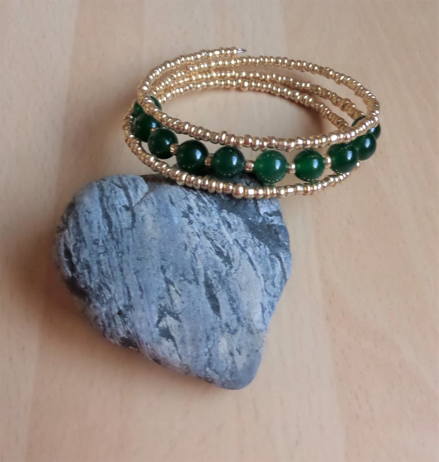 Gold and green gemstone memory wire wrap bracelet.