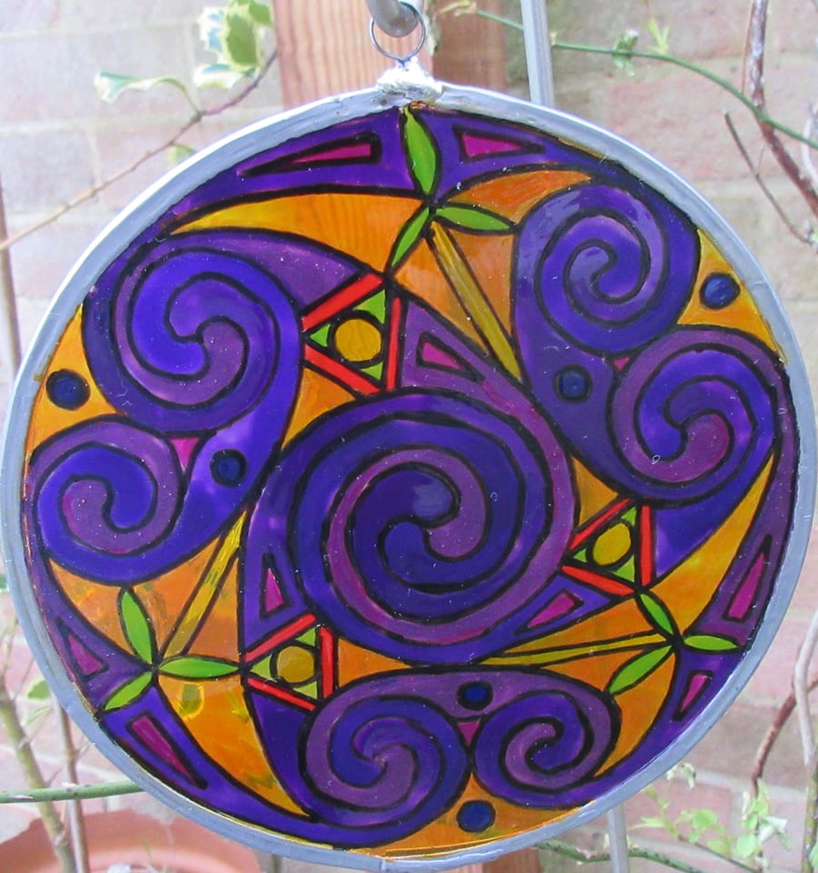 Suncatcher - Celtic Spirals  in purples with a saffron background - large