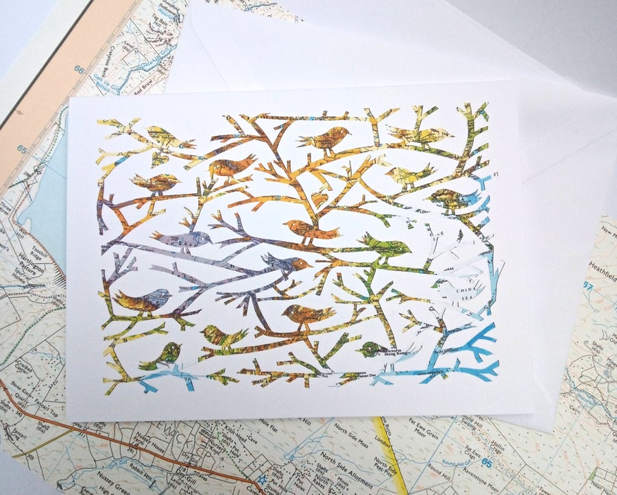 Birds Of A Feather, papercut on vintage map