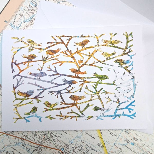 Birds Of A Feather, papercut on vintage map