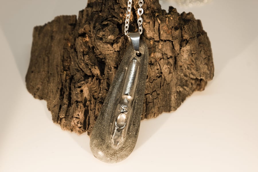 Stone pendant with ink nib, 10