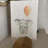 Hand painted baby elephant greeting card with pink balloon