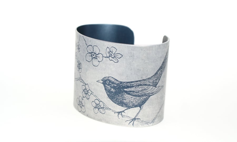 Blackbird and blossom cuff