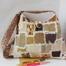 Pyramid shaped shoulder bag in oatmeal and brown