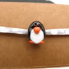 lampwork glass penguin jewellery, fabric bracelet