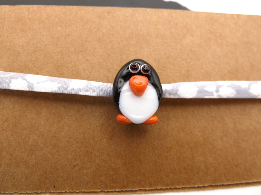 lampwork glass penguin jewellery, fabric bracelet