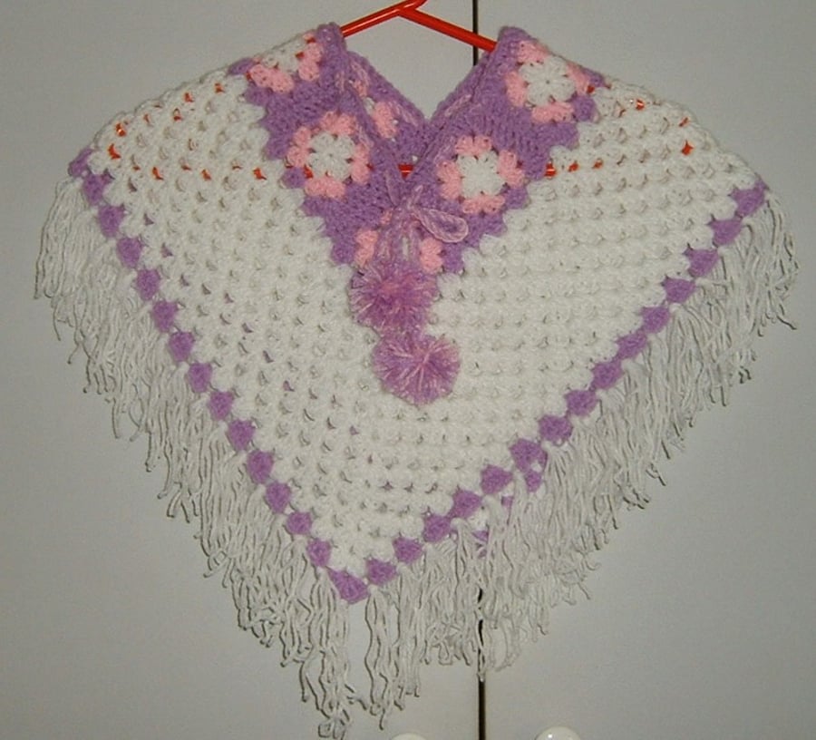 baby girl's crocheted poncho ref C050
