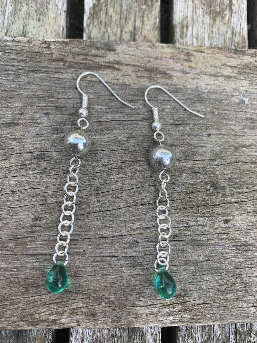 Silver plated dangle earrings with aqua glass bead