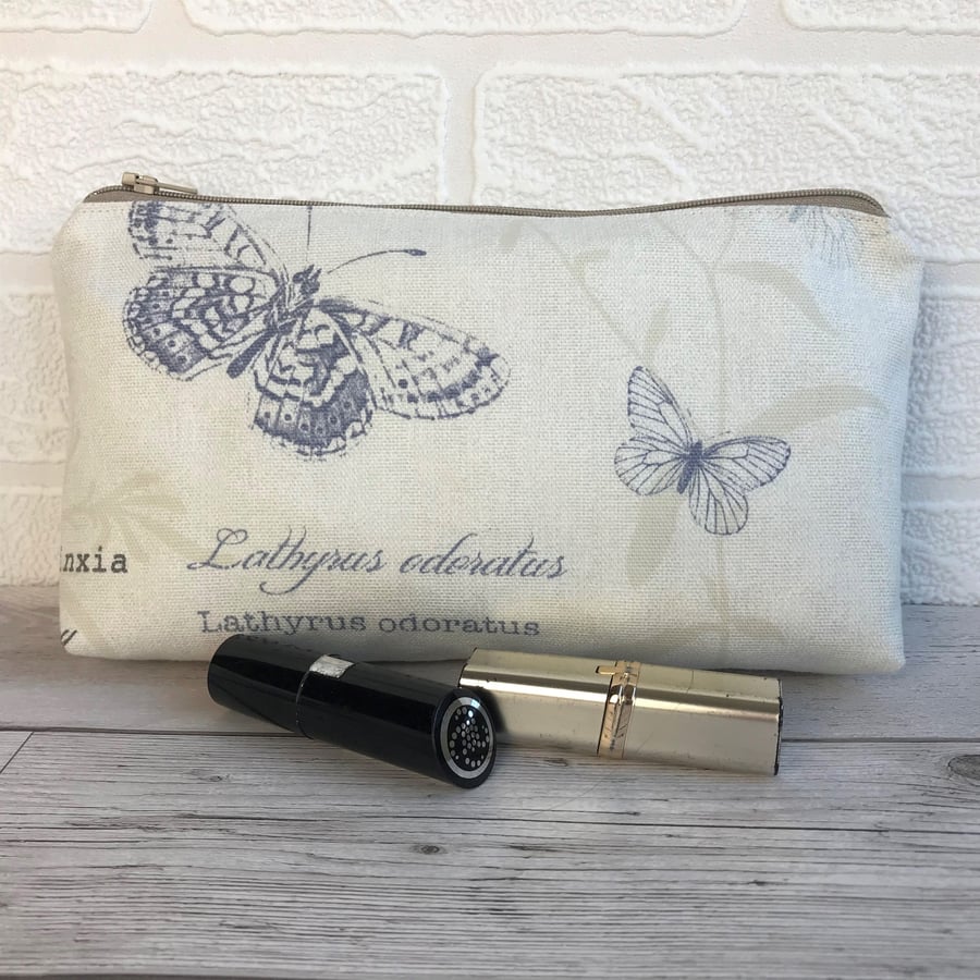 Cosmetic bag, make up bag in cream with blue butterflies