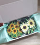 Wooden coasters set of two, each handpainted with a different sunflower plant.  