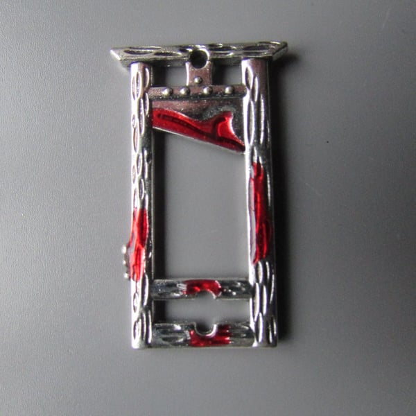 Guillotine Tibetan Charm