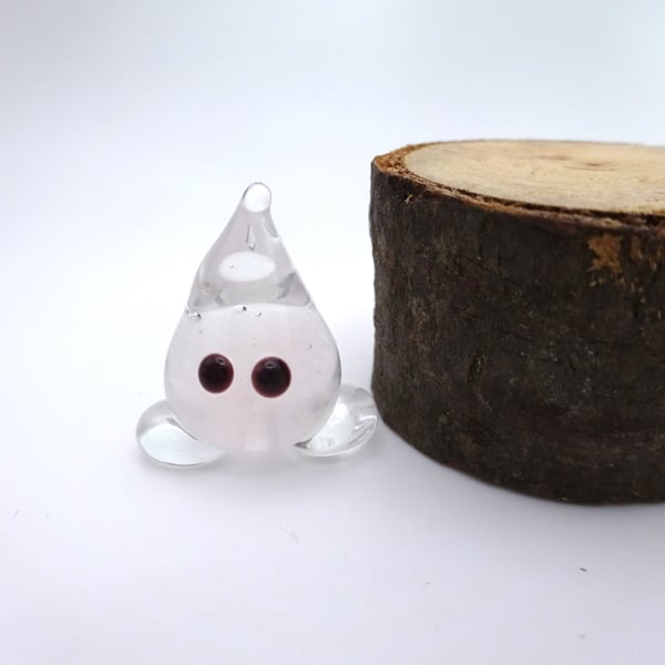 small glass wisp figure