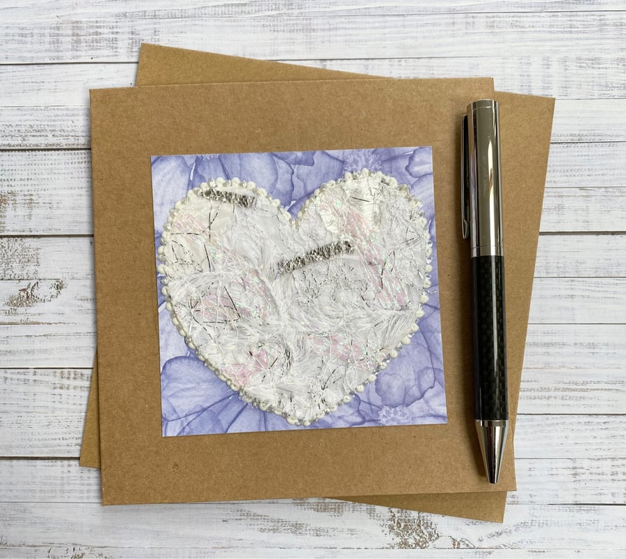 Up-cycled white embroidered heart card. 