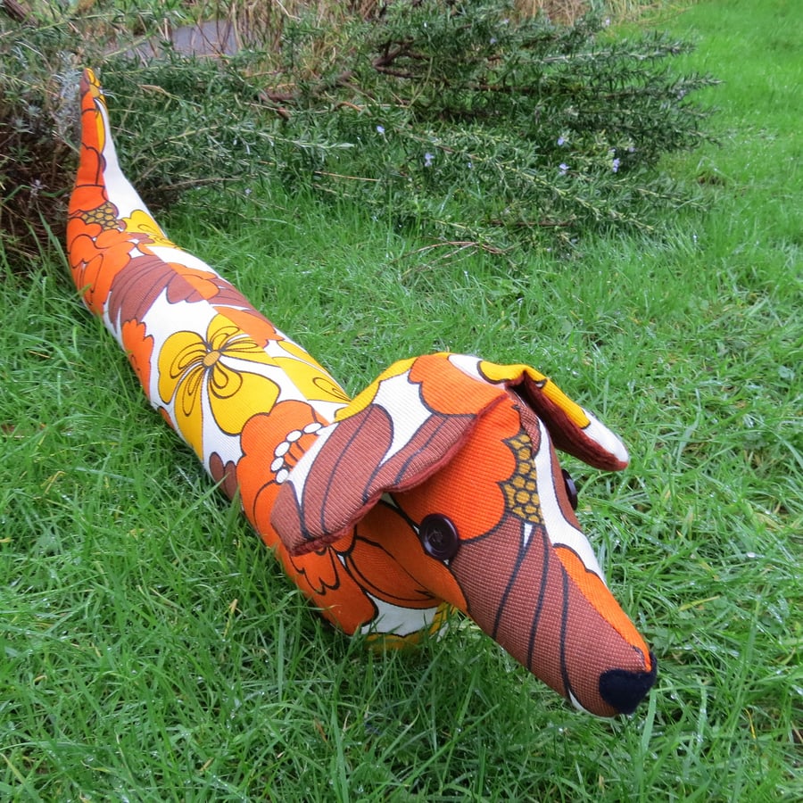 Marigold, a groovy dog draught excluder.