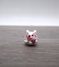 small glass cat figure with heart