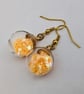 Glass Christmas bauble earrings - pale orange stars - Image 1