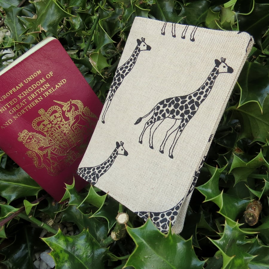 A passport cover with a giraffe design.  Passport sleeve.  Travel Gift.