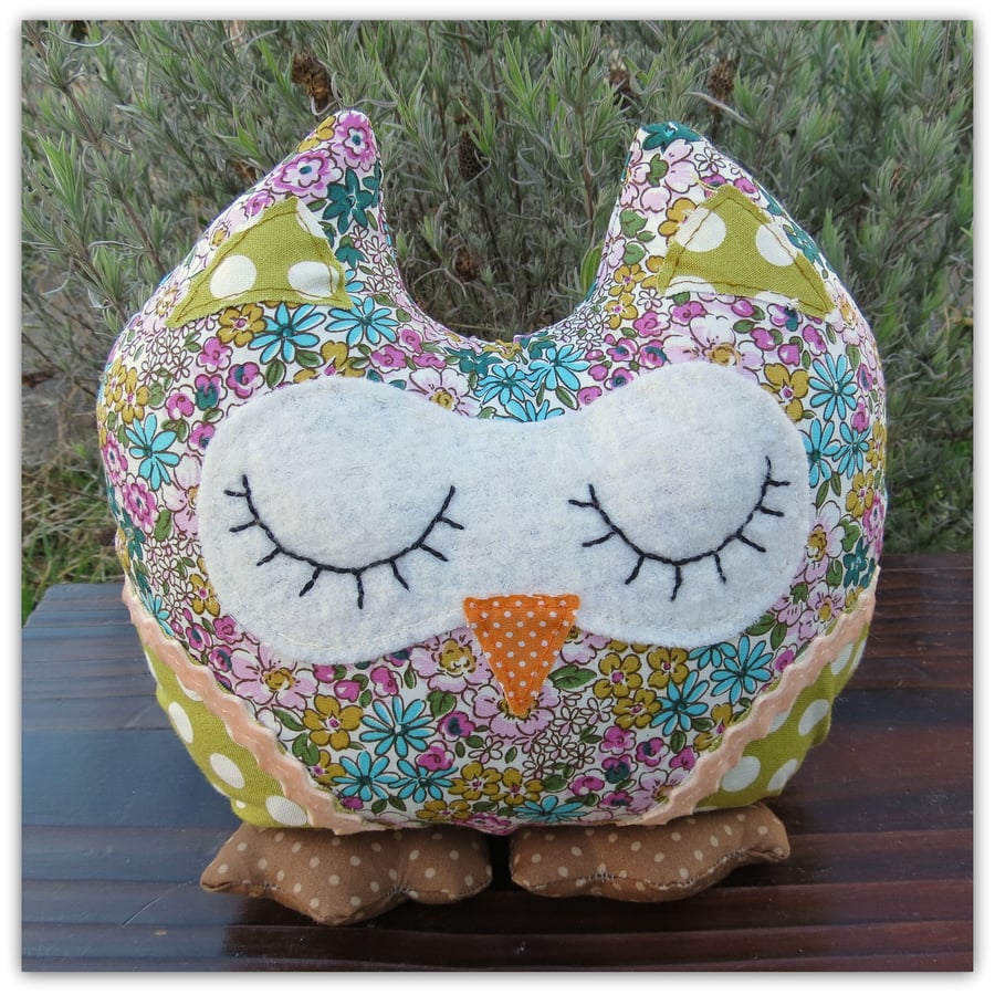 Hibiscus, a snoozy owl doorstop.  Owl bookend.