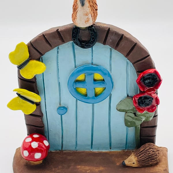 Magical fairy door with poppies & sunshine yellow butterflies
