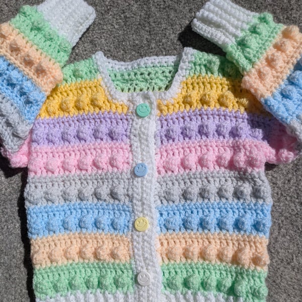 Multi coloured pastel cardigan for one year old with smiley buttons 
