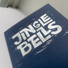 Jingle Bells linocut printed card – silver metallic ink on navy card