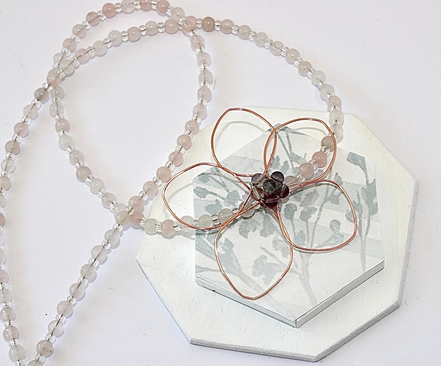 Beaded necklace with wire flower