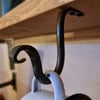Hand Forged Under Cabinet or Shelf Hook, with matching screws.