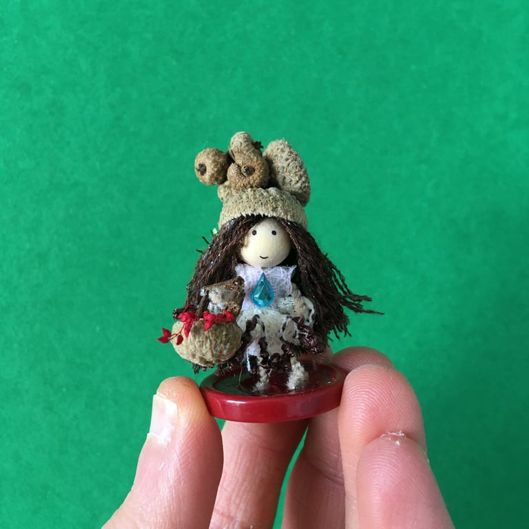 Tiny Button Fairy With A Basket And An Acorn Cup Hat