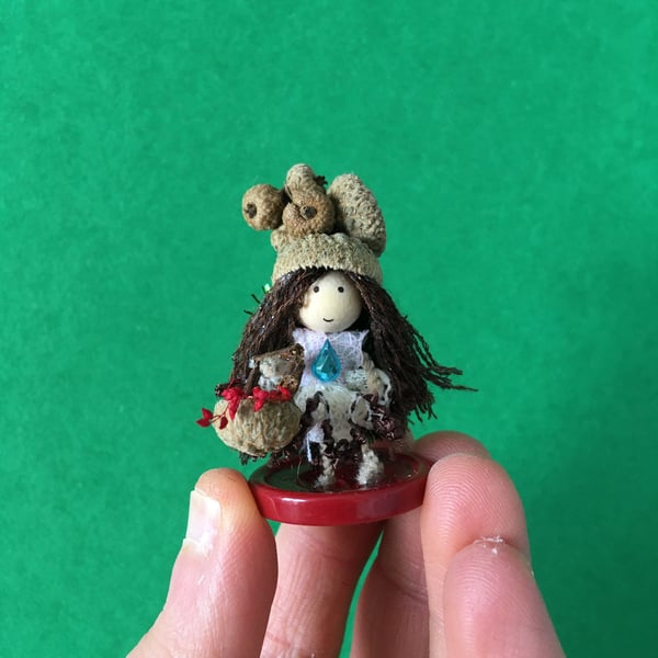 Tiny Button Fairy With A Basket And An Acorn Cup Hat