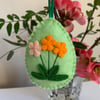 Easter decoration. Orange and peach flowers. Wool felt. Handmade.