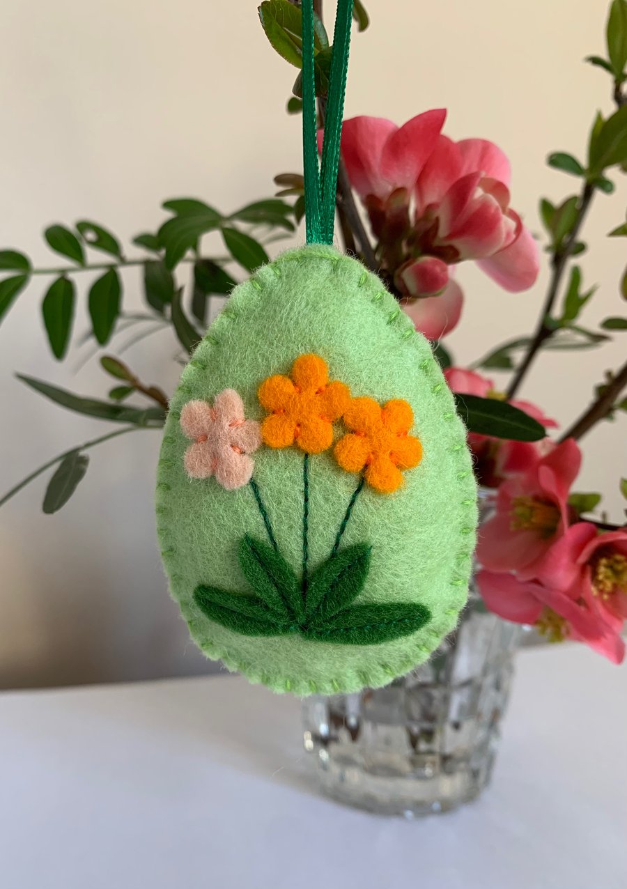 Easter decoration. Orange and peach flowers. Wool felt. Handmade.