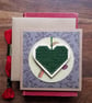 Dark green Christmas decoration with robin card