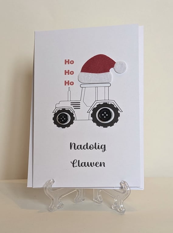 Nadolig Llawen (Merry Christmas) card with a tractor, santa hat and button wheel