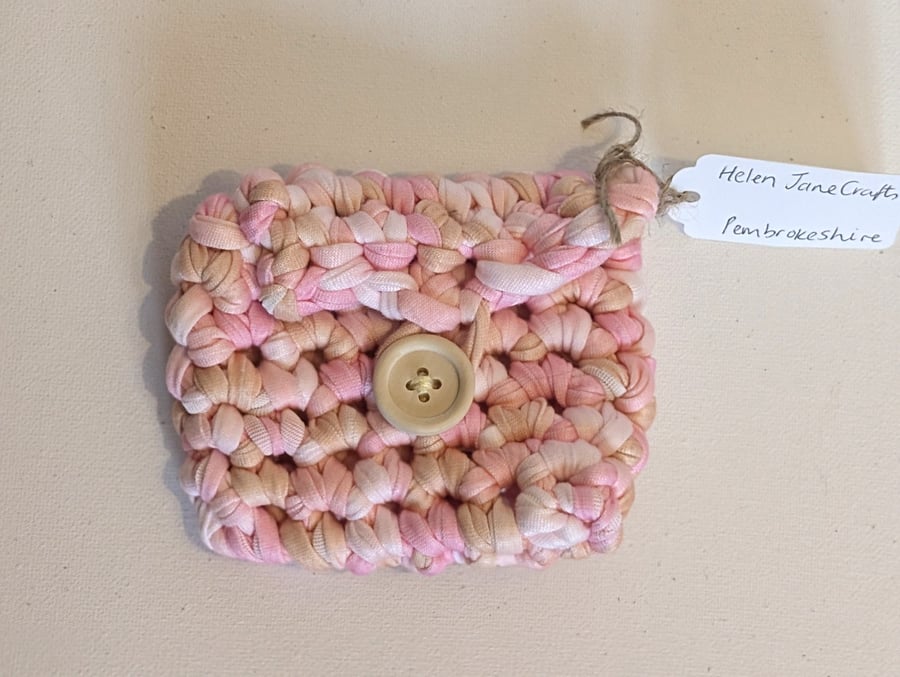 Handmade crochet mini purse made with multicoloured pink t-shirt yarn 