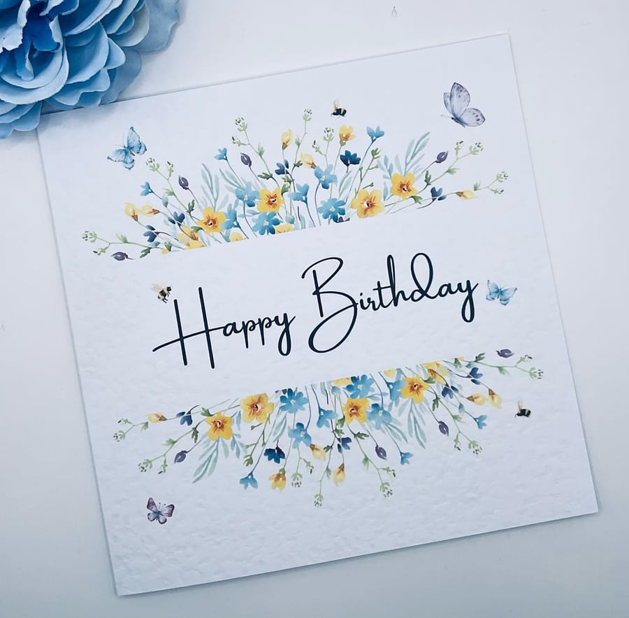 Happy birthday card with wildflower and  butterfly