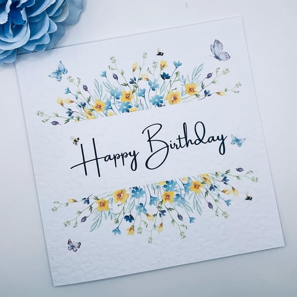 Happy birthday card with wildflower and  butterfly