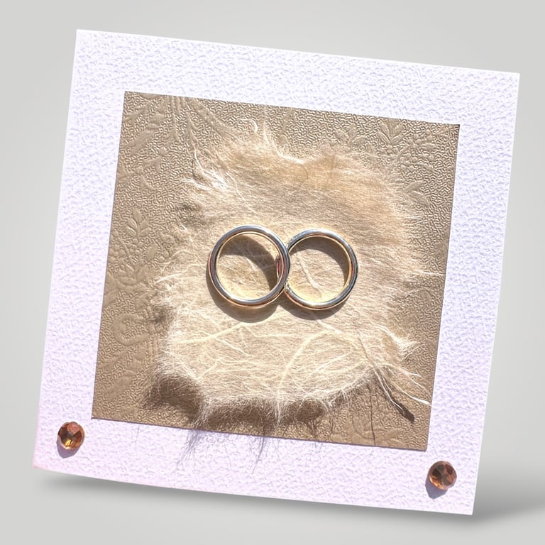 Handmade Wedding Card, entwined Gold rings with embossed and handmade papers. 