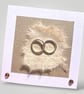 Handmade Wedding Card, entwined Gold rings with embossed and handmade papers. 