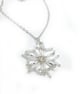 Silver and white beaded snowflake pendant necklace on trace silver chain