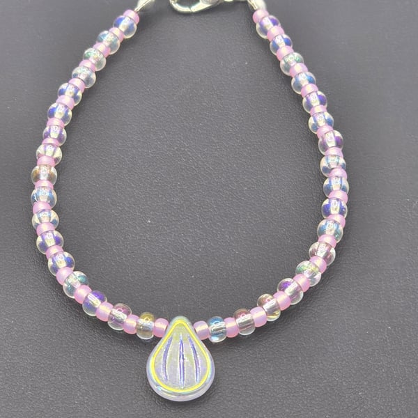 Crystal pip bead bracelet with clear crystal and rose seed beads