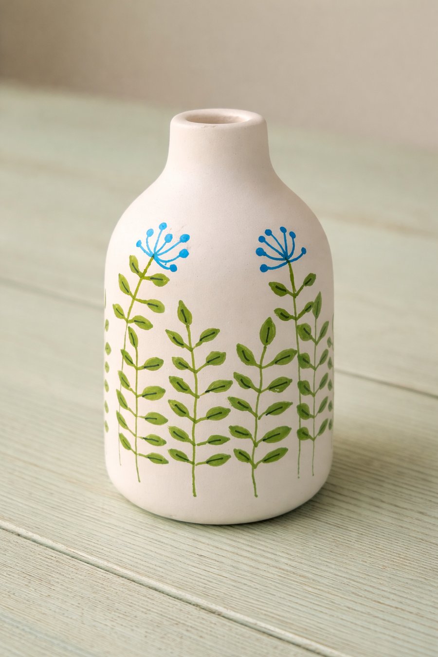 Small ceramic vase with hand drawn flowers 