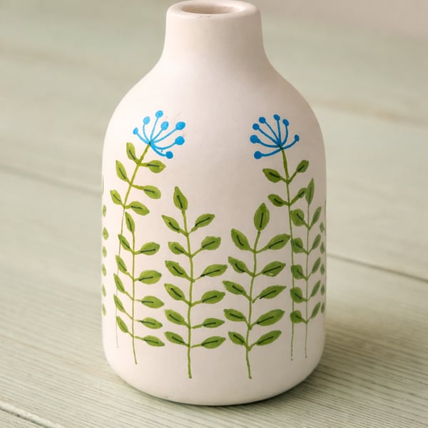 Small ceramic vase with hand drawn flowers 
