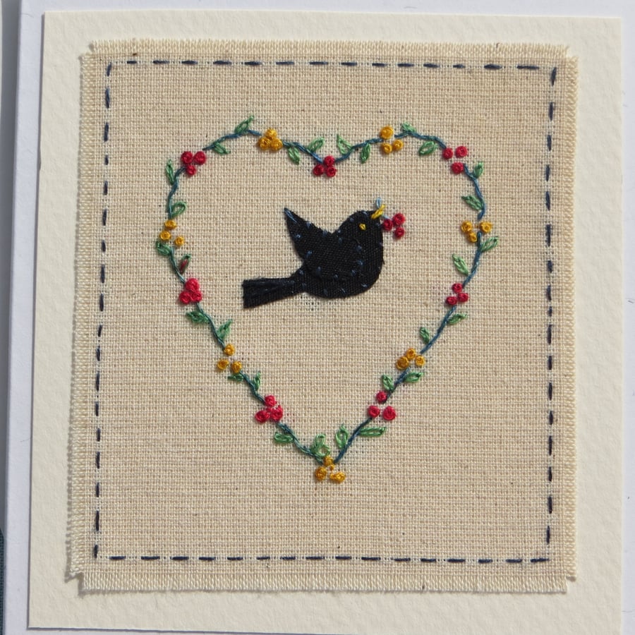 Hand-embroidered heart berry wreath with blackbird entitled 'Christmas Dinner!'