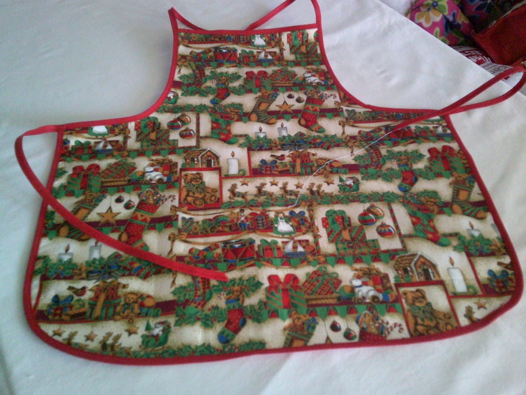 Holly, Parcels, Toys and Stockings Baby Christmas Apron