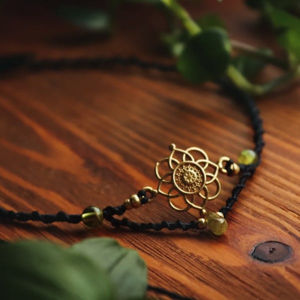 Adjustable black choker with peridot and flower brass charm 